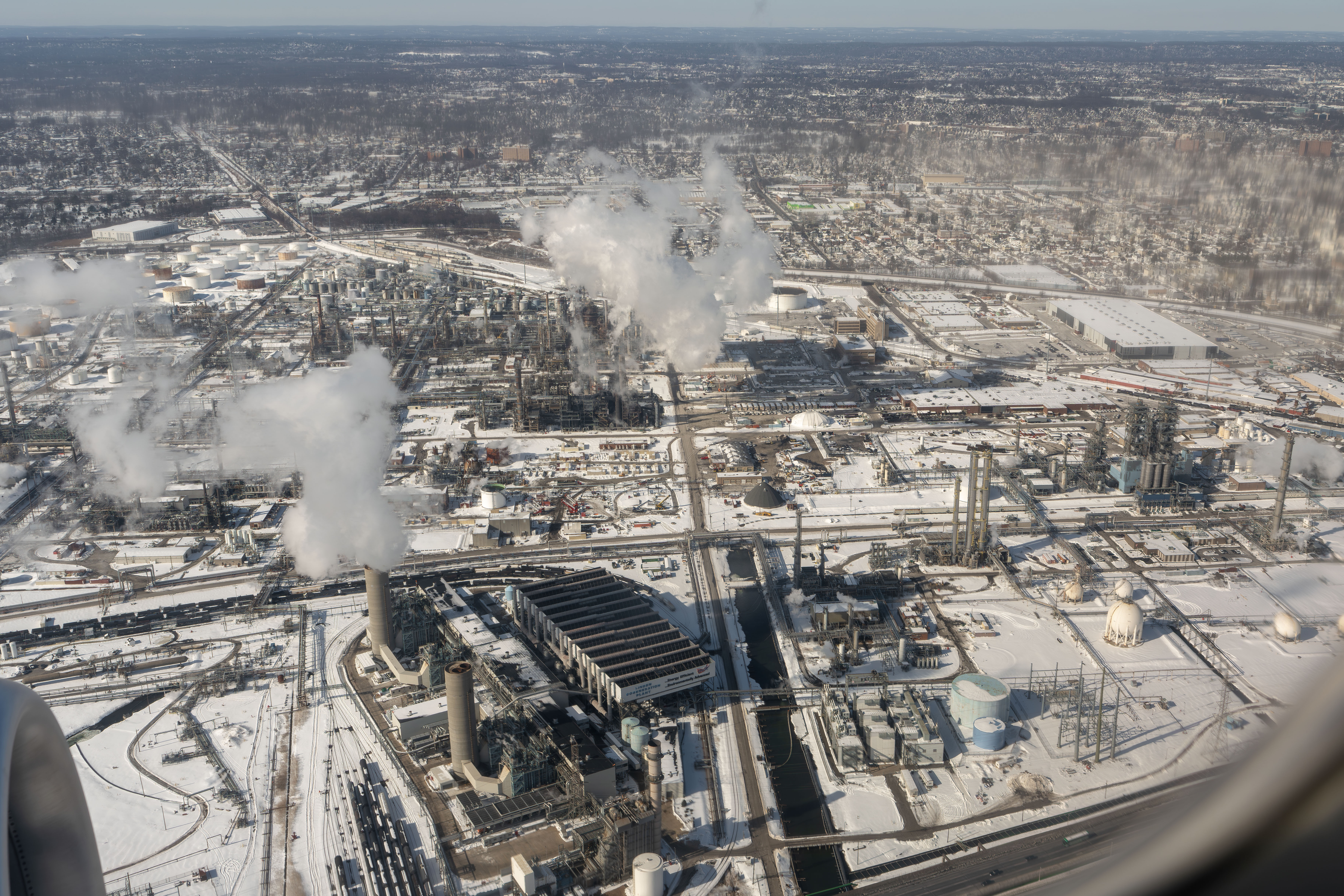 Modern chemical manufacturing plant with processing towers and piping systems